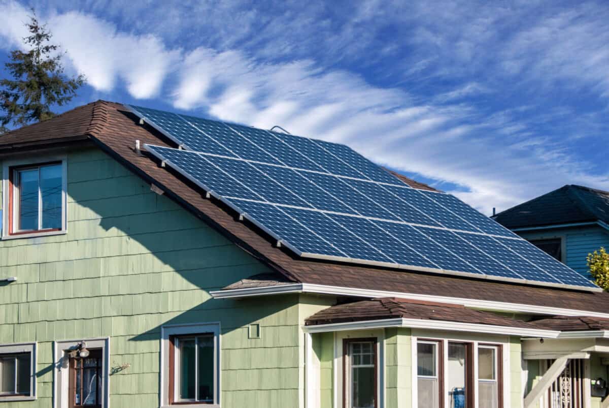 Solar panels installed and in use on the roof of a house.