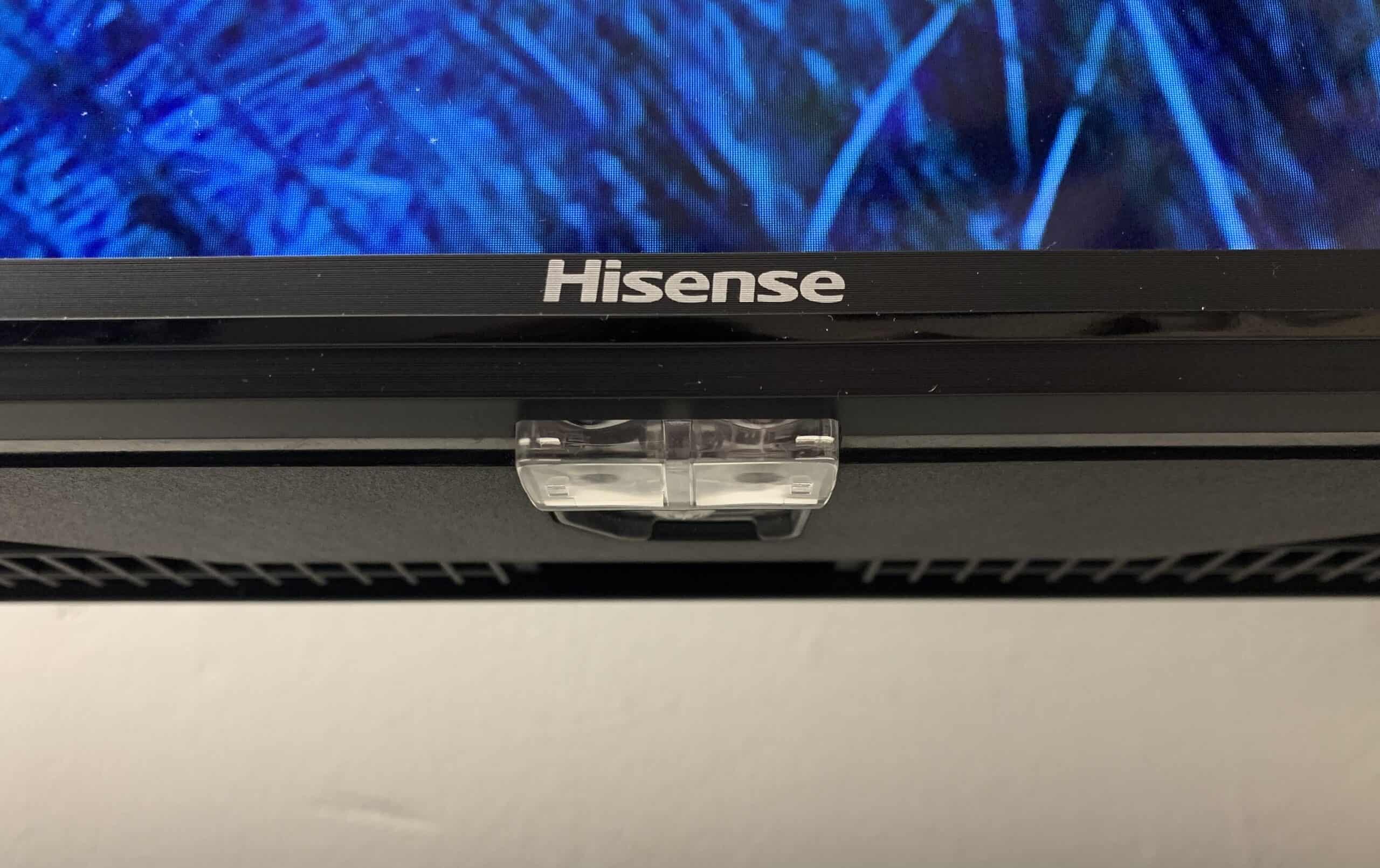 Bottom of Hisense TV screen with power button.