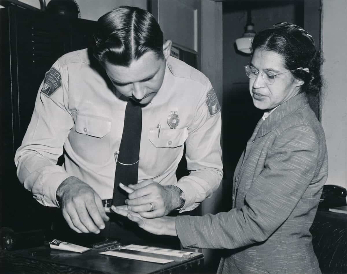 Rosa Parks being fingerprinted by police.