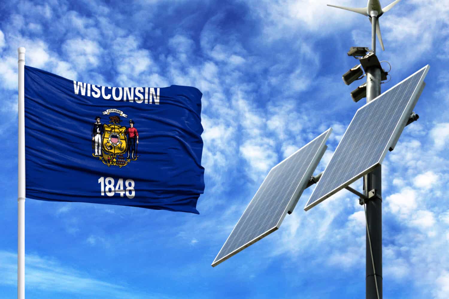 Solar panels on a background of blue sky with a flagpole and the flag State of Wisconsin