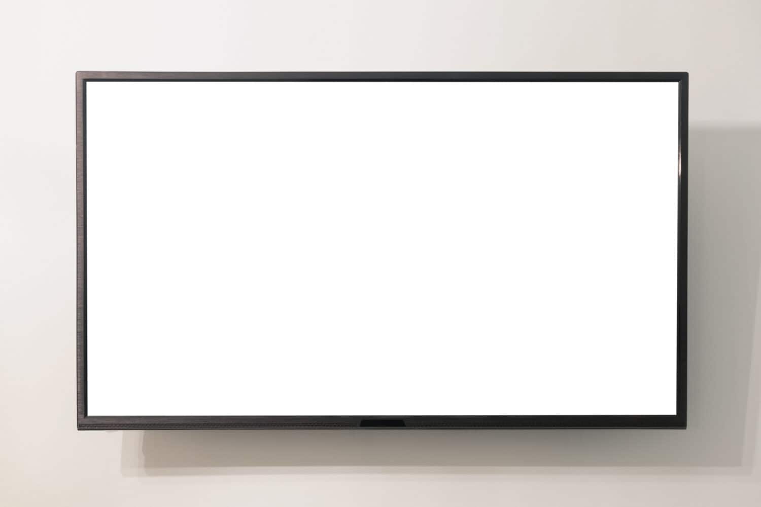 Modern widescreen TV set with blank screen hanging on the wall. Frame tv