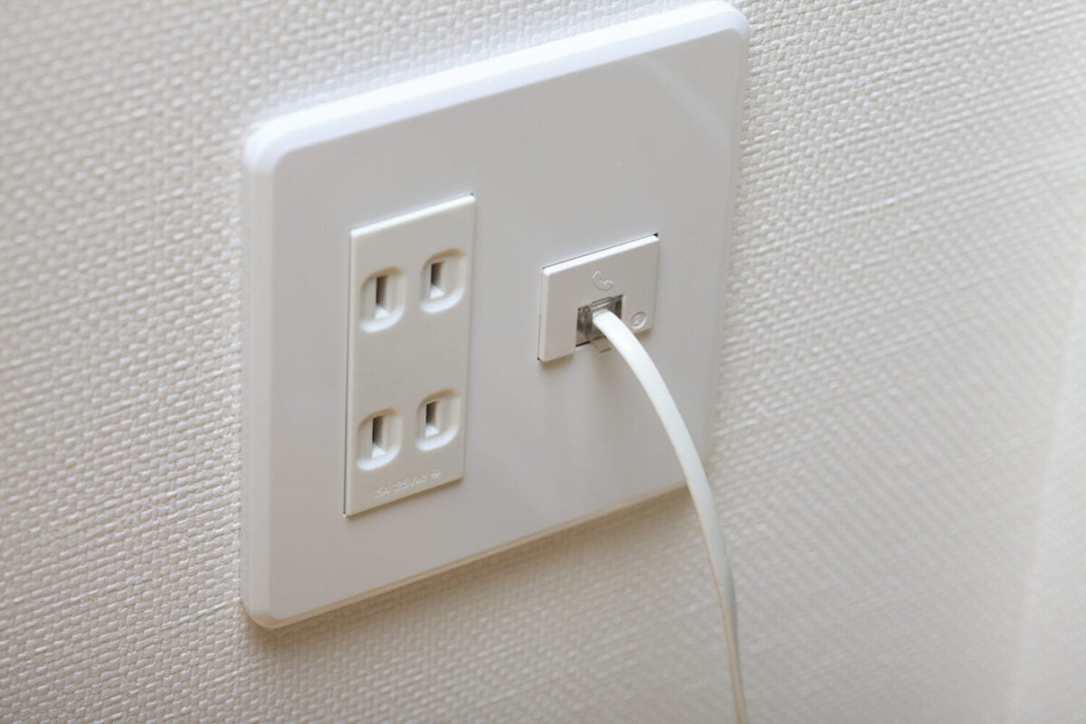 An image of a Japanese electrical outlet (wall socket or mains) and phone jack