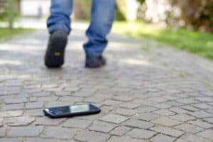 Man walking after losing his smart-phone