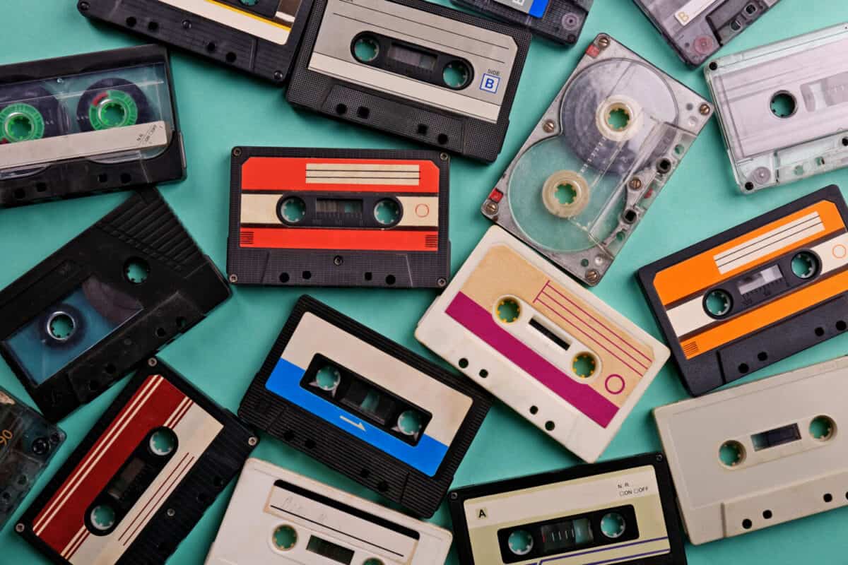 Set of old audio cassettes on blue background
