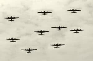 Featured image for the 10 Shortest Wars article. Group of World War II heavy bombers on a mission