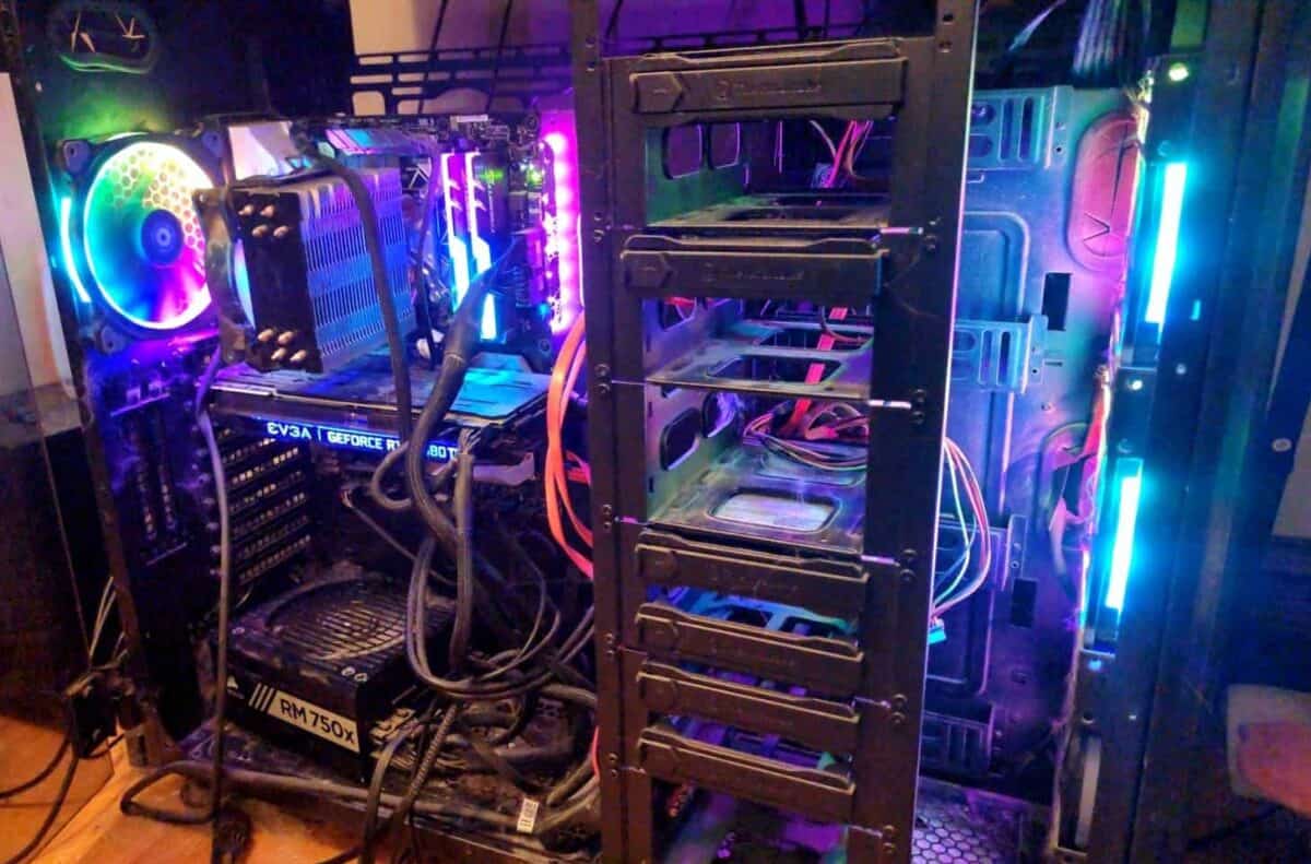 A gaming PC with the side open, featuring RGB lighting.