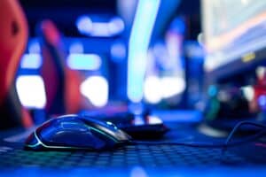 Close up view of computer mouse in video game room. Entertaining industry.