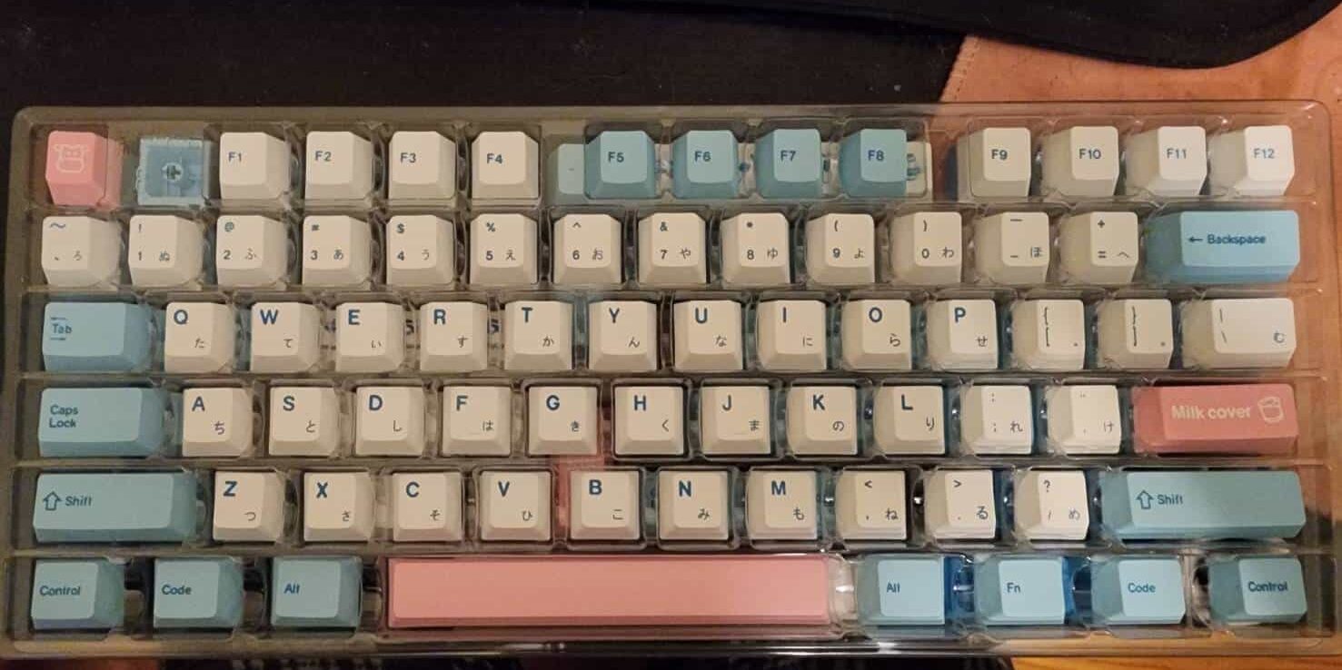 A set of pink, white, and blue keycaps.