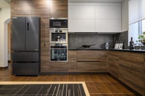 Modern large luxurious dark brown, gray and black cozy kitchen interior