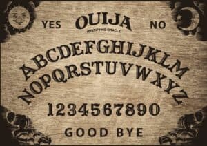 Planchette of Ouija Board on wooden texture. Poster with game of ghosts. Halloween play with calling souls and demons. Party poster. Graphic, typography, alphabet, letters, numbers.