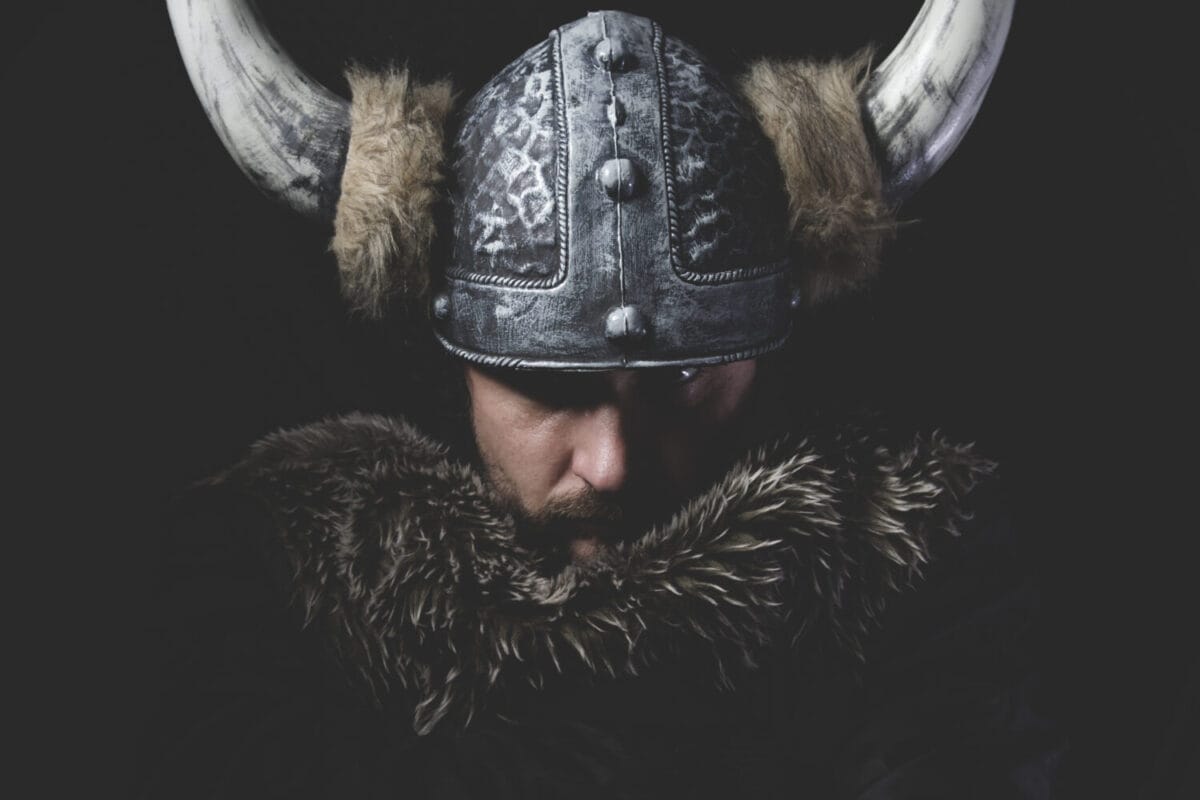 Danger, Viking warrior with iron sword and helmet with horns