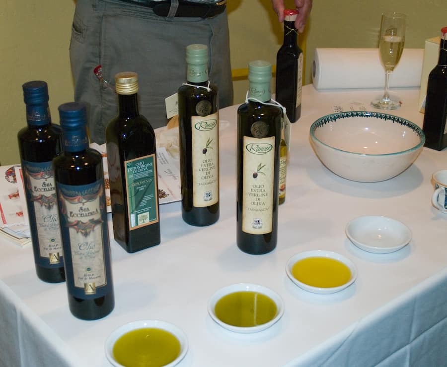 Several bottles and dishes of extra virgin olive oil.