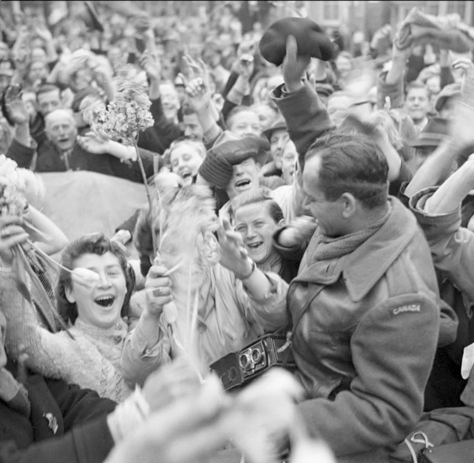 Crowd of Dutch civilians celebrating the liberation of Utrecht by the Canadian Army