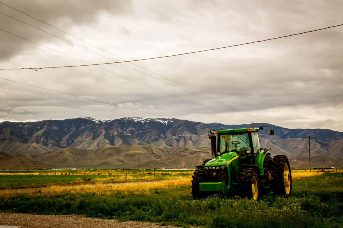 tractor in front of a mountain