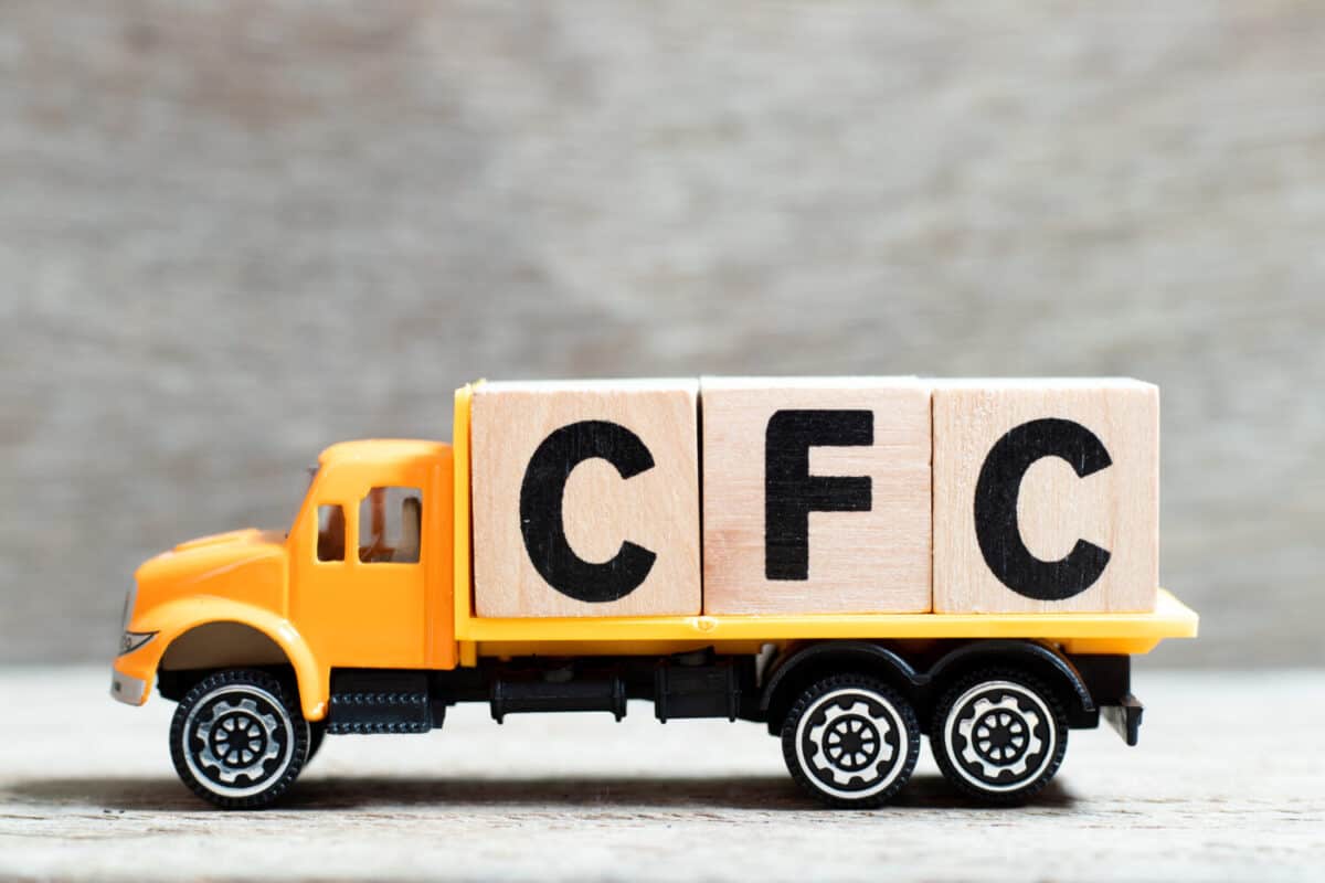 Truck hold letter block in word CFC (abbreviation of Chlorofluorocarbon) on wood background