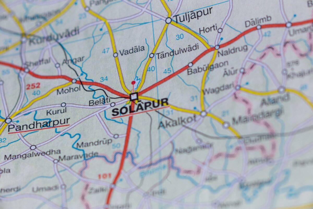 Map of India, in focus Solapur city with roads and surroundings macro shot, from above.
