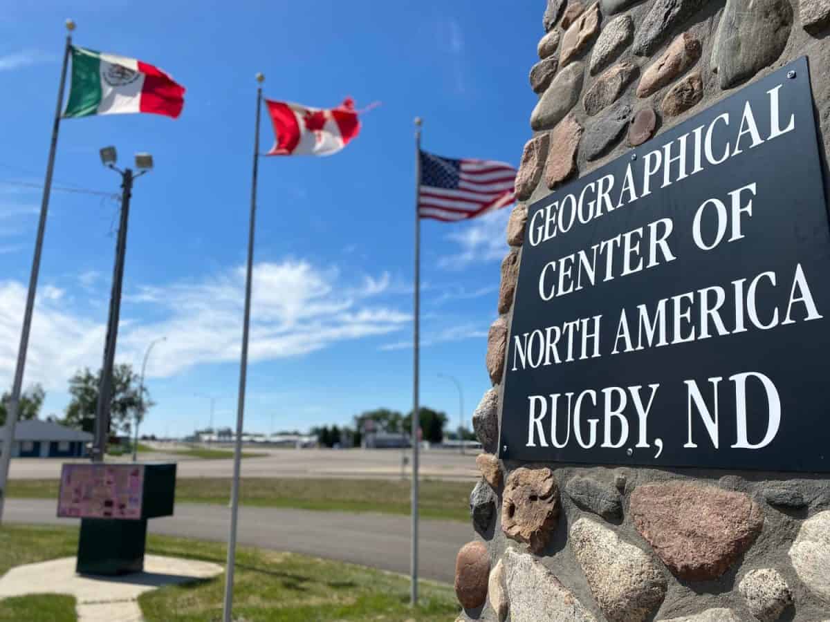 Geographical Center of North America Sign in Rugby, North Dakota with Mexico, Canada and United States Flags