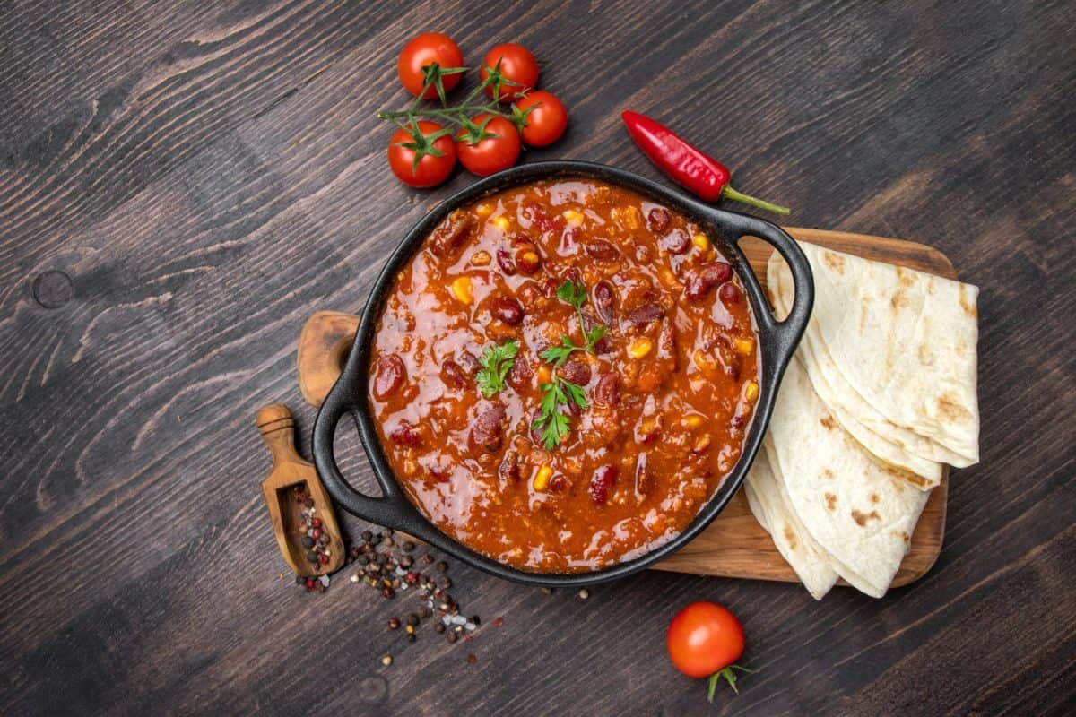 Kidney bean soup or ragout, kidney bean stew on a wooden background. Protein food
