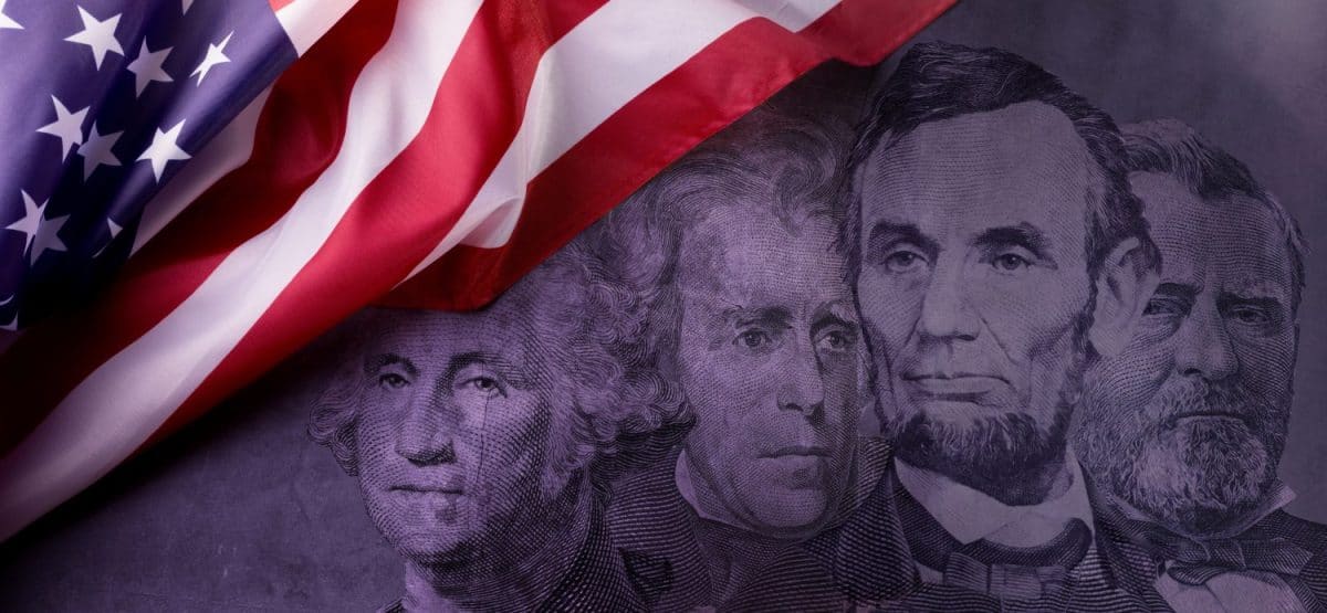 Happy Presidents Day Concept with the US national Flag against a collage of four American Presidents portraits cut of Dollar bills.