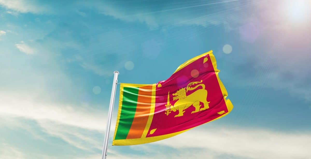 Sri Lanka Flag on pole for Independence day. The symbol of the state on wavy cotton fabric.
