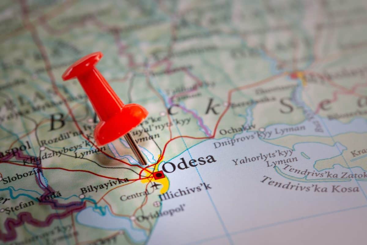 A red push pin marking the port city of Odesa on the Ukraine coastline giving access to the Black Sea and invaded by Russian forces during the Special Military Operation