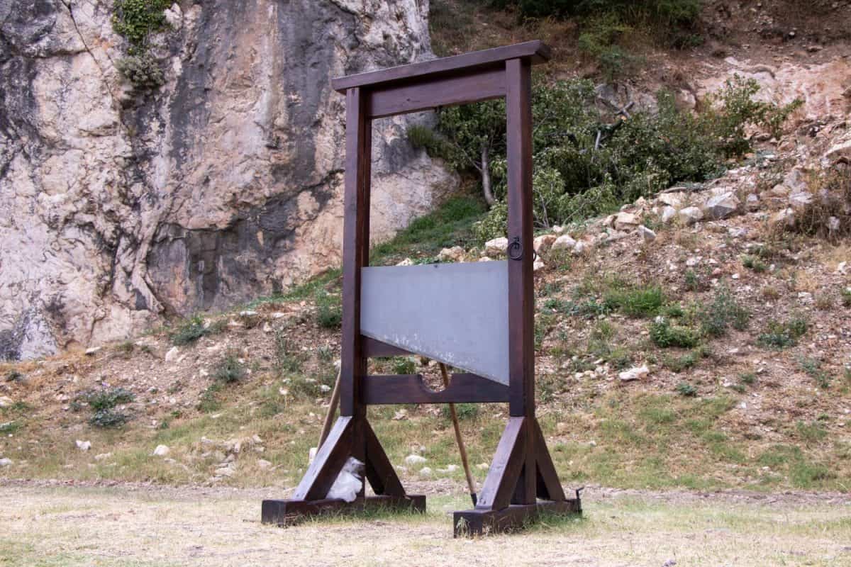 Old wooden guillotine for panishement stand alone in a park