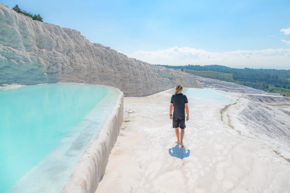 Tourist walking in a sunny day at the beautiful Travertines, Pamukkale, Turkey.