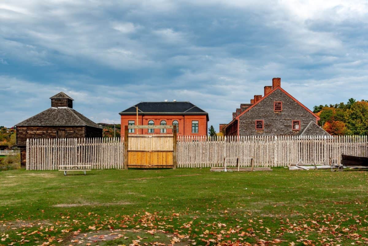 Historic Old Fort Western in Augusta, ME, on a cloudy day in Fall season