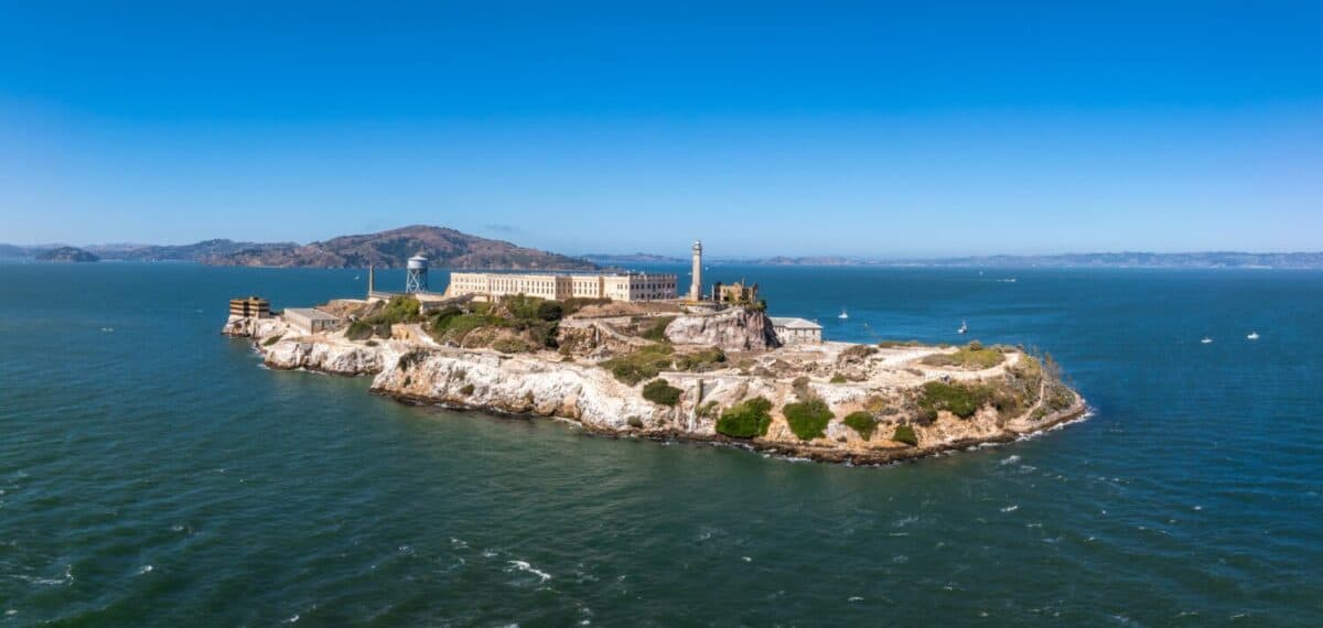 Aerial view of the prison island of Alcatraz in San Francisco Bay, Alcatraz jail in San Francisco bay aerial view. Beautiful aerial view of the Alcatraz island with Golden Gate bridge.