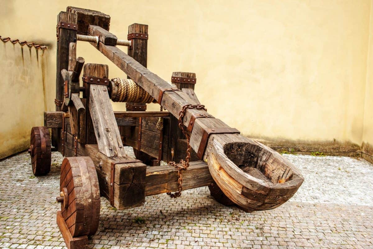 Wooden Medieval Catapult Ballistic Device. Ancient Military Technology