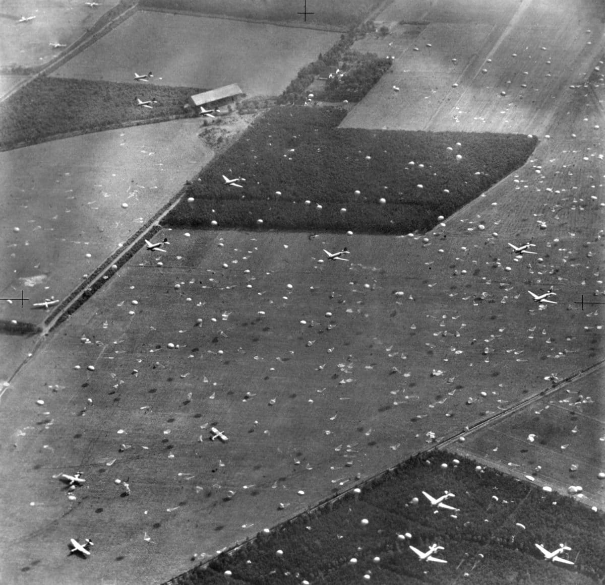 Allied planes drop paratroopers onto Holland's fields already dotted with gliders and airborne troops. Sept. 17, 1944. Field Marshall Montgomery's 'Operation Market Garden' plan to capture key bridges