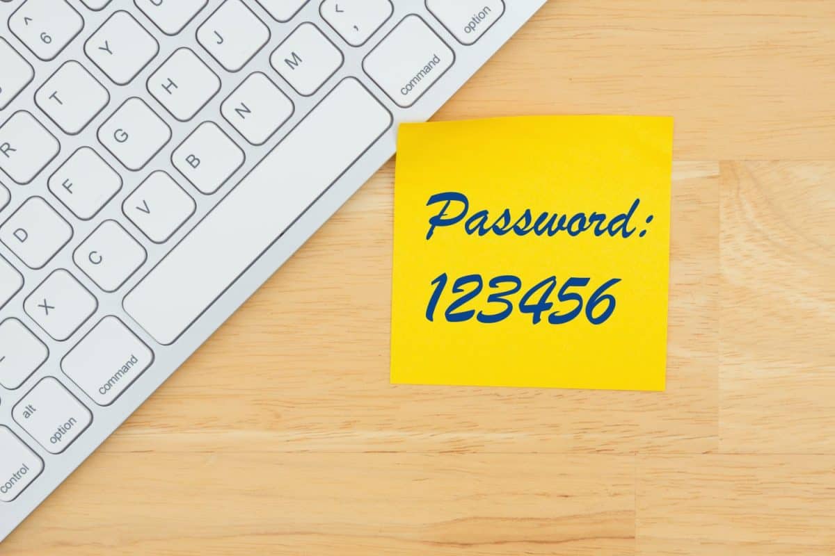 123456 worst password ever on a sticky note with a keyboard on a desk