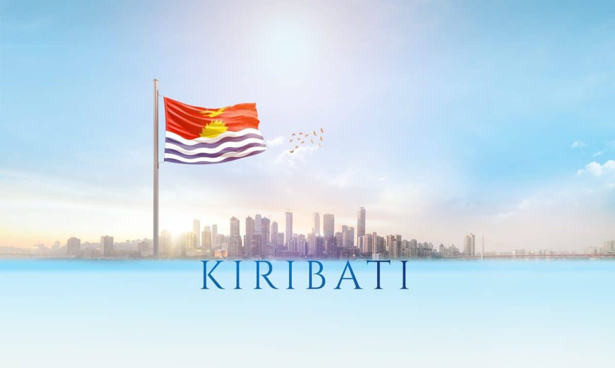 Kiribati national flag waving in beautiful building skyline.