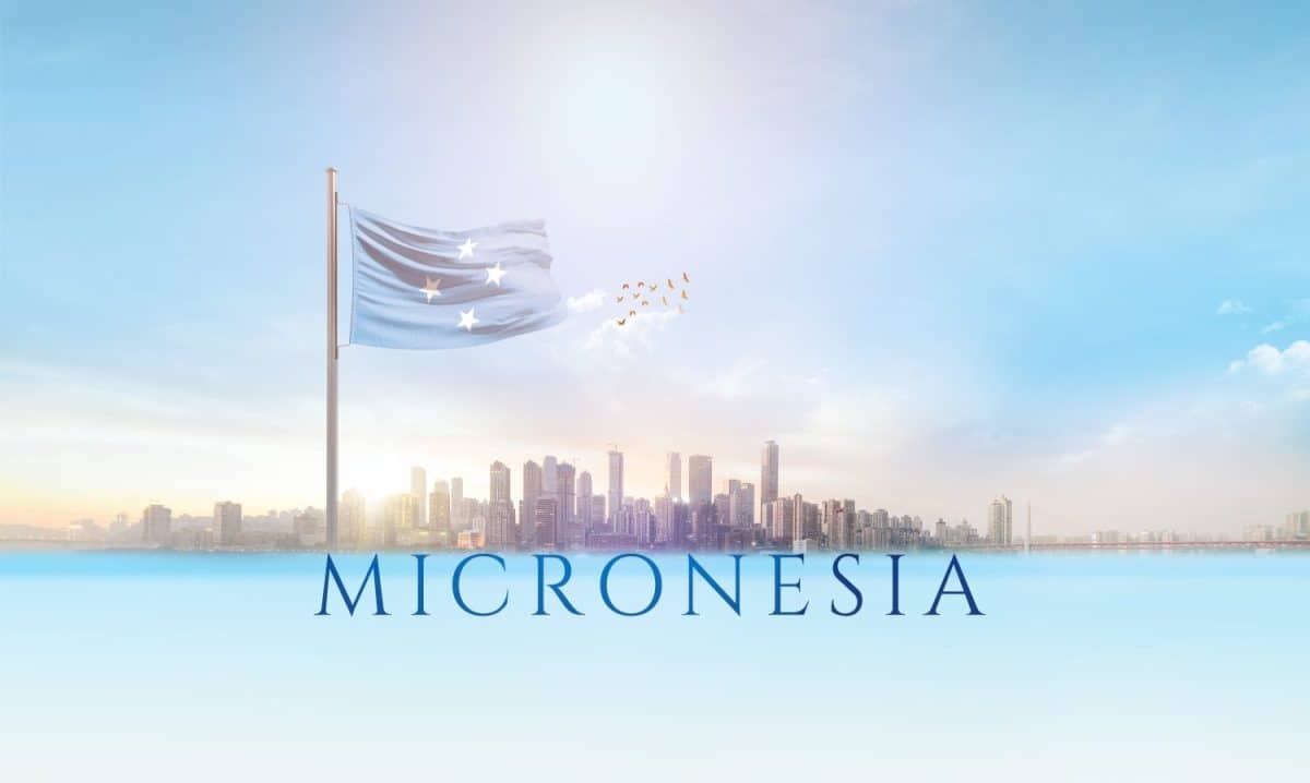 Micronesia national flag waving in beautiful building skyline.