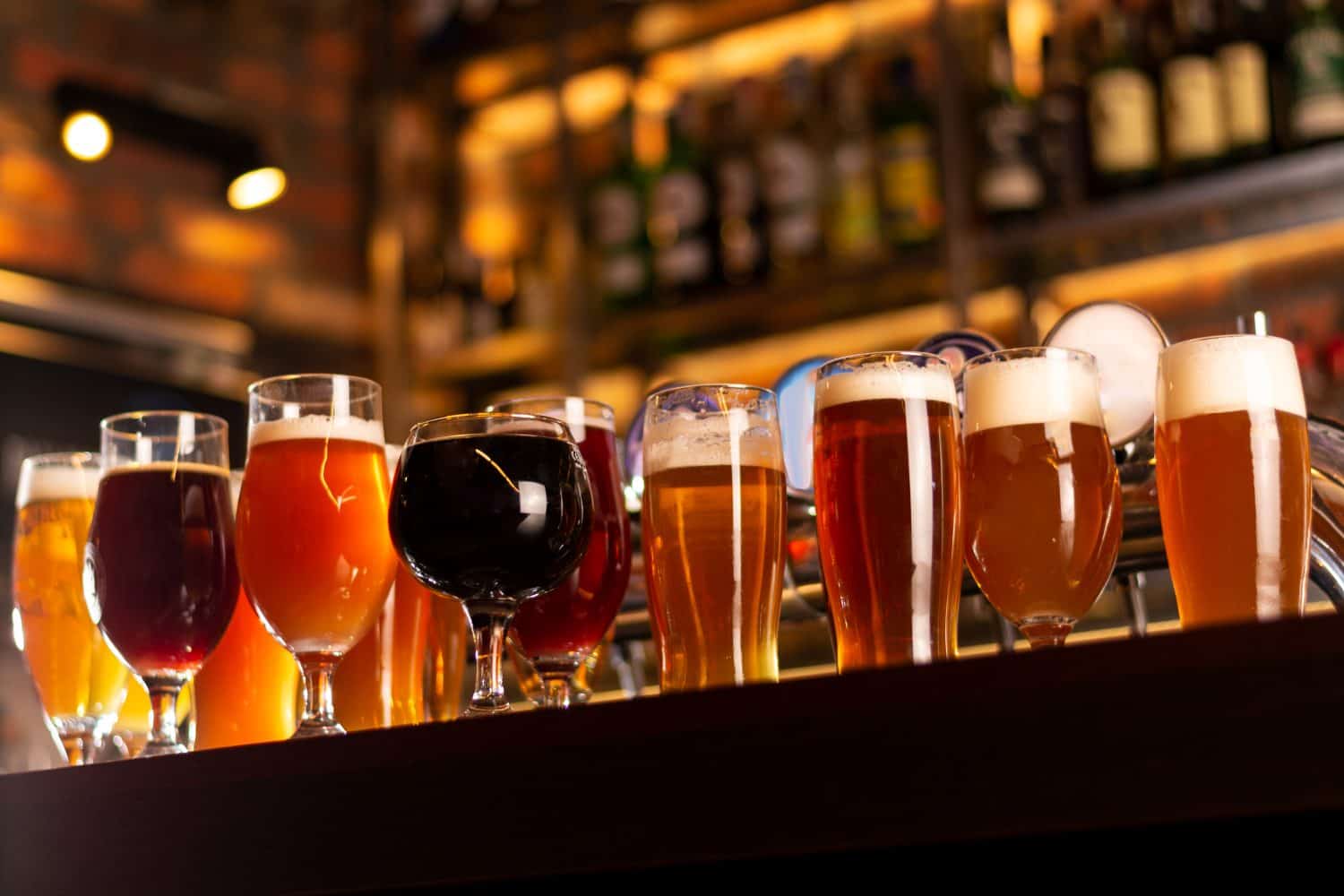 a lot of beer on bar table