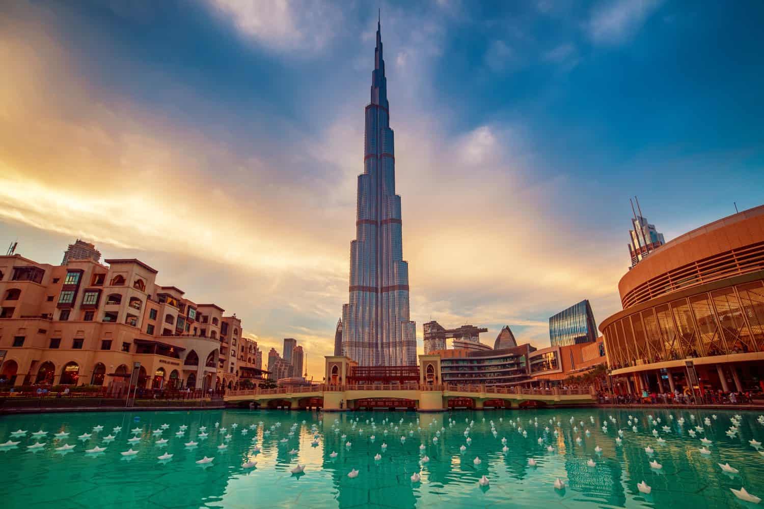 Burj Khalifa in Dubai, UAE. The tallest skyscraper building in the world, travel attraction with blue pool on foreground