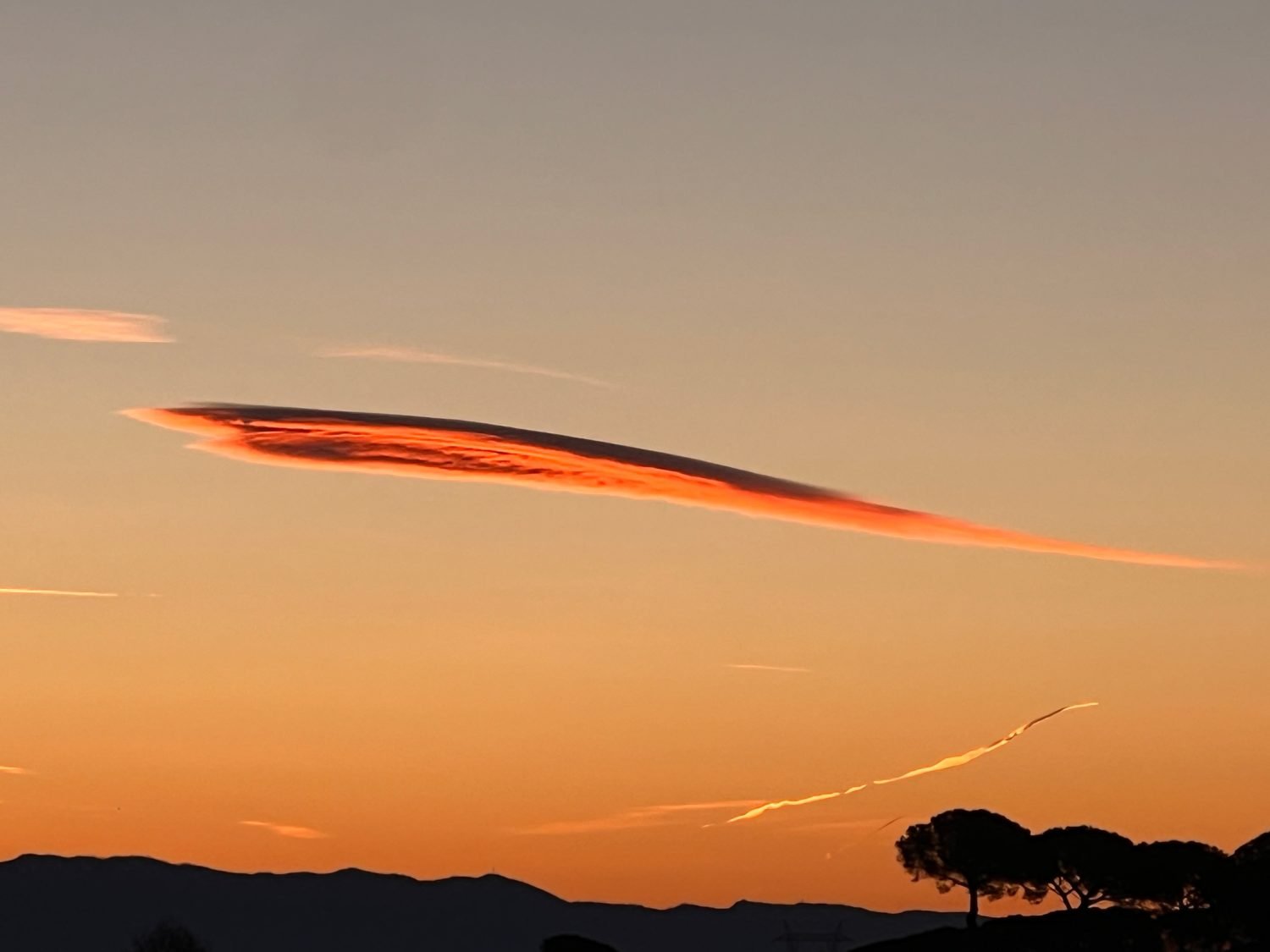Strange cloud in a form of orange arrow
