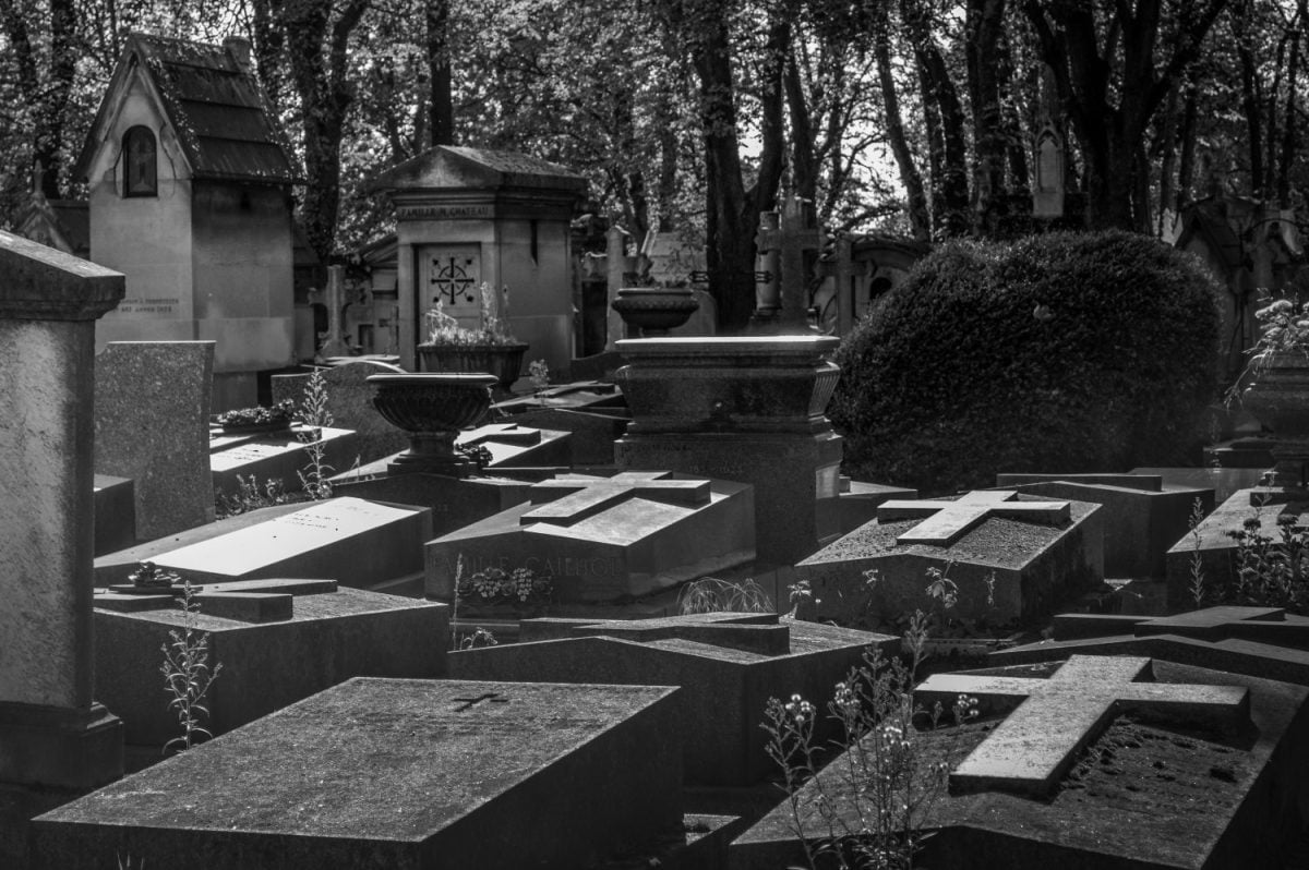 Tombs and crosses in Pere Lachaise Cemetery in Paris in black and white