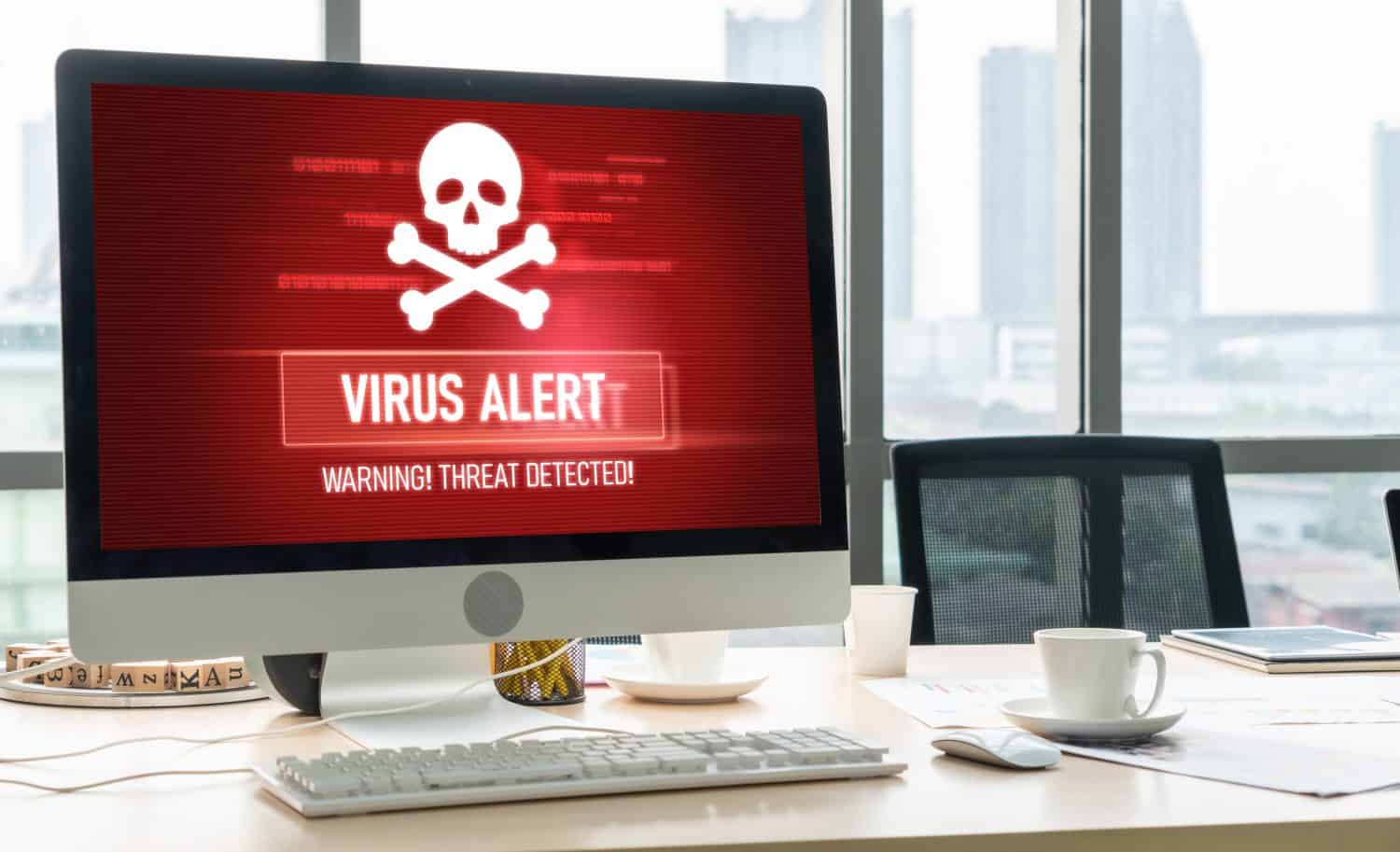 Virus warning alert on computer screen detected modish cyber threat , hacker, computer virus and malware