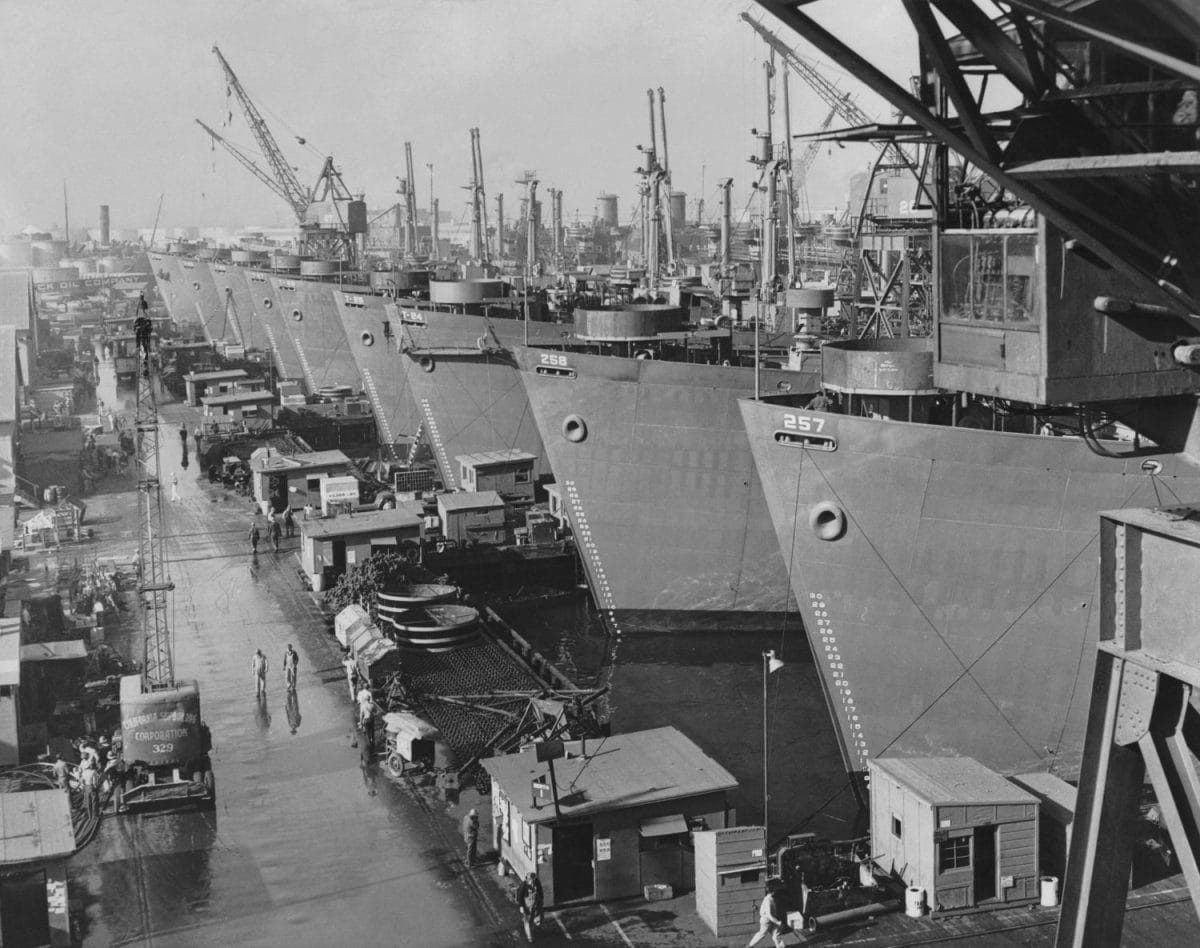 Nine huge Liberty cargo ships at docks of California Shipbuilding Corporation. Los Angeles, Dec. 4, 1943.