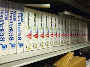 Unopened boxes of Microsoft Windows Me and Corel WordPerfect 8