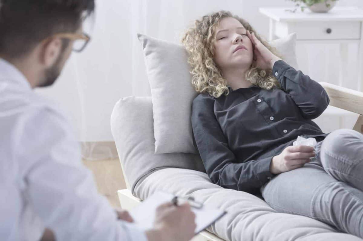 Woman tired by her obsessions at psychotherapist