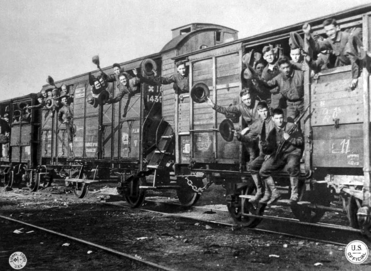 World War I, American marines on their way to training camp in France in Hommes 40, Chevel 8 railroad boxcars, 1917, U.S. Signal Corps photograph