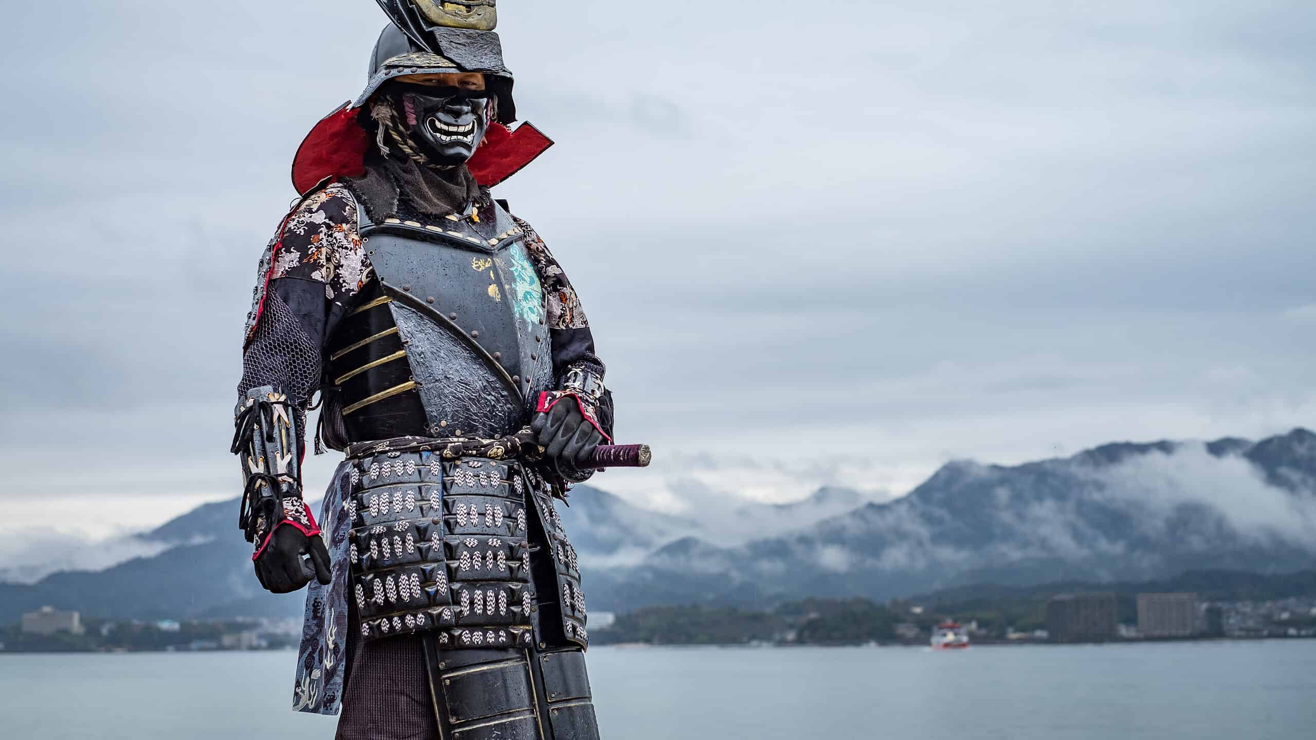 Samurai warrior with mountains and water in background