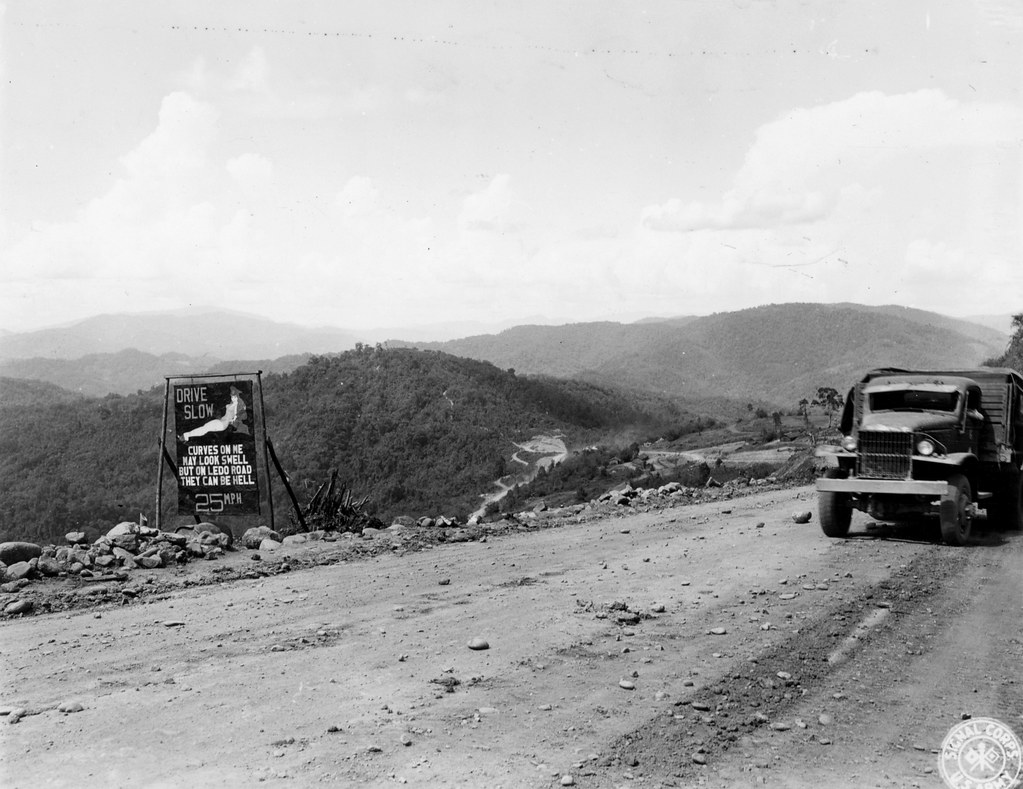 SC 192082-S - One of the many signs along the Ledo Road telling the GI truck drivers to slow down on this very crooked road. This one is located just before you come into Tagap, Burma. 29 May, 1944.