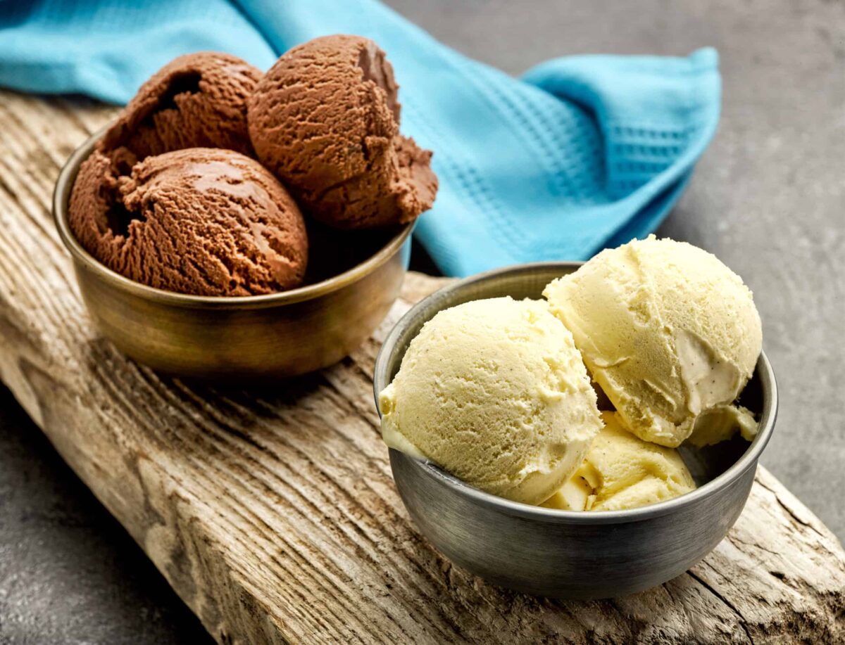 vanilla and chocolate ice cream on wooden board