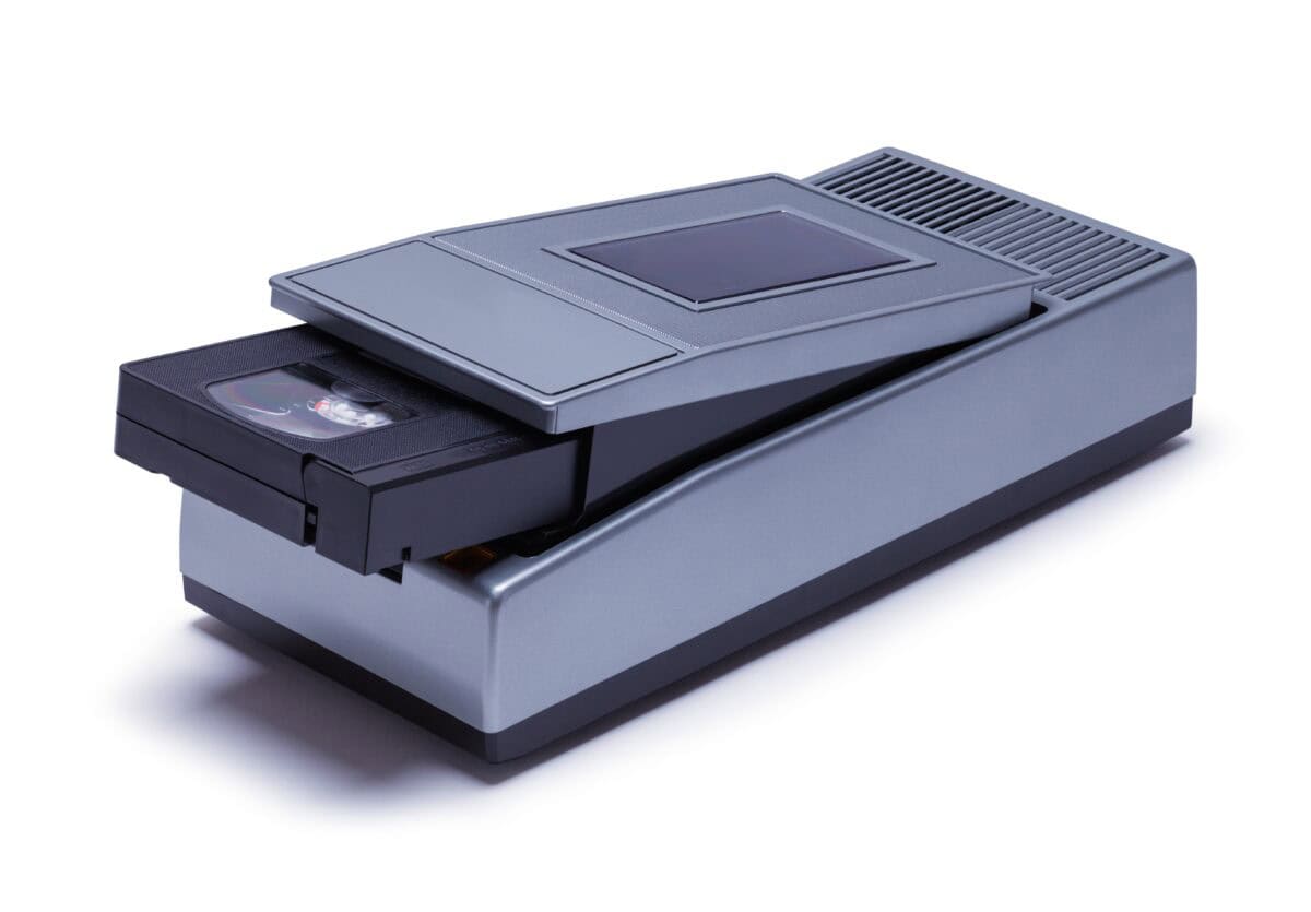 VHS Rewinder and Tape Cut Out on White.