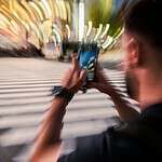 Honolulu, Hawaii: Looking at Your Phone While Crossing the Street